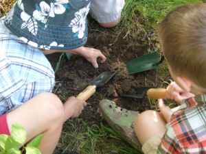 Children digging holes for pitfall traps