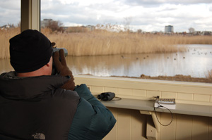 Mike Dilger enjoys the view from one of the large picture windows in the Headley Discovery Hide