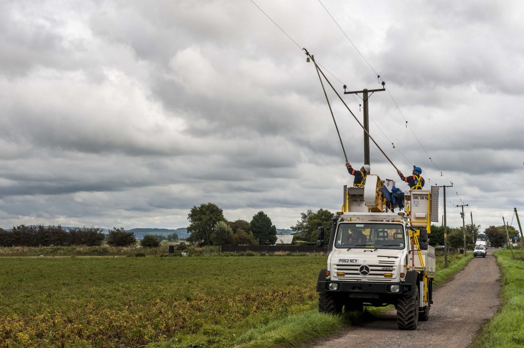 Fitting bird diverters to live wires near WWT Martin Mere (c) Martin Birchall