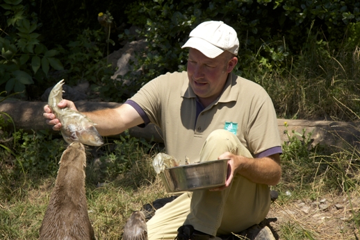 John feeds a fish lollie to the Otters