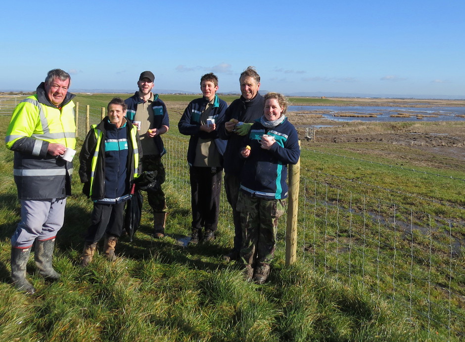 The volunteer team celebrated with tea and cake. The marshes to the right will be covered by high tides this week