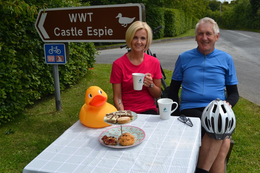 Castle Espie Centre Manager Sarah Clarke is pictured with Roy, a regular cyclist and Castle Espie visitor at the Pop-up Pit Stop on the Ballydrain Road.