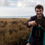 Ed Burrell holding a cutting of peat on Islay