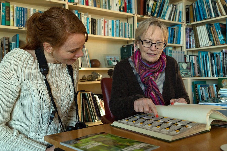 WWT researcher Julia Newth shows Mrs Girling some of the original drawings from WWT's long running Bewick's swan study (c) Sam Stafford WWT