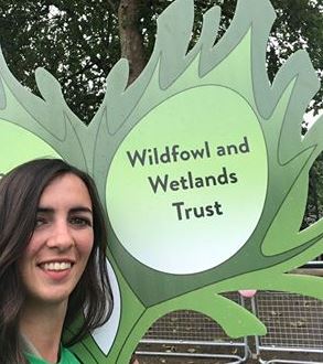 Ellie Wise carries the WWT sign in the Patron's Lunch parade