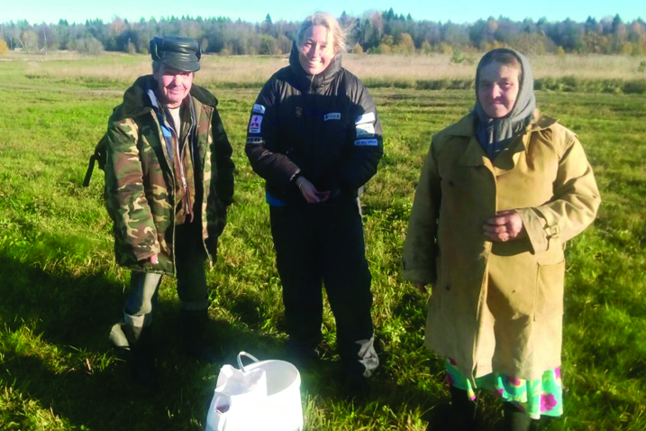 A local couple offering cranberries to Sacha