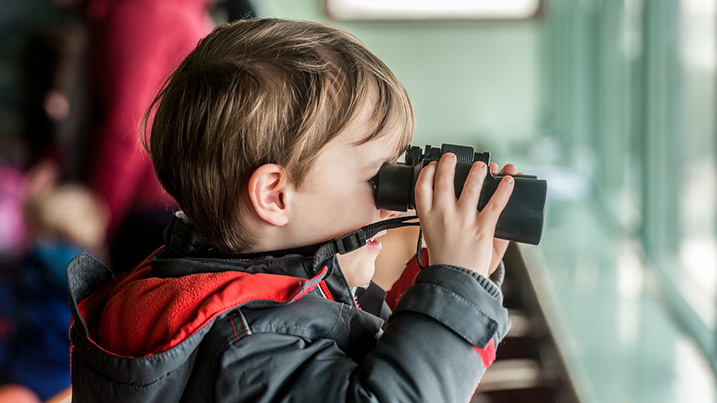 Young child with binoculars