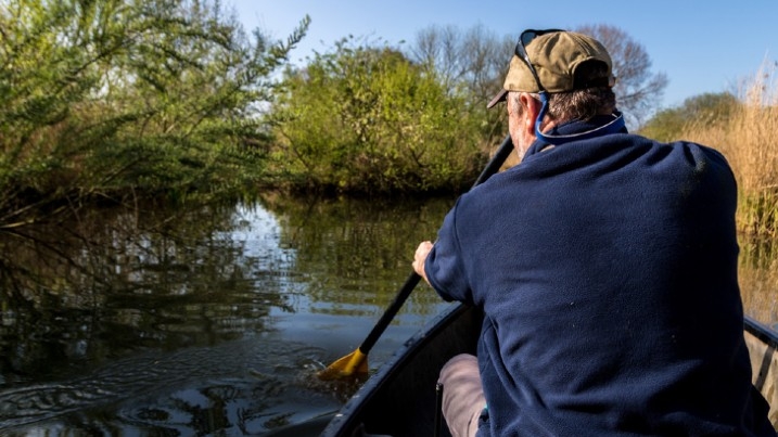 A man paddling a canoe