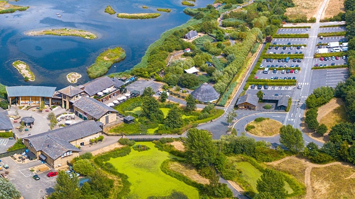 Aerial view of London Wetland Centre with car park