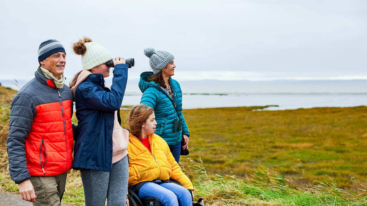 A family visiting wetlands in winter