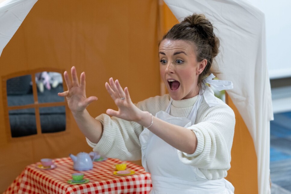 A photo of Ellie the storyteller performing a Babis Bach Babies story