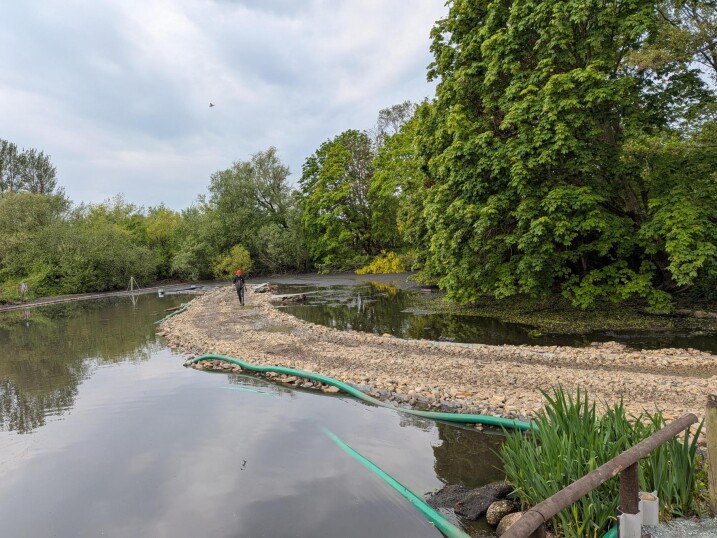 A paved pathway for where the stepping stones will sit, before raising the water levels